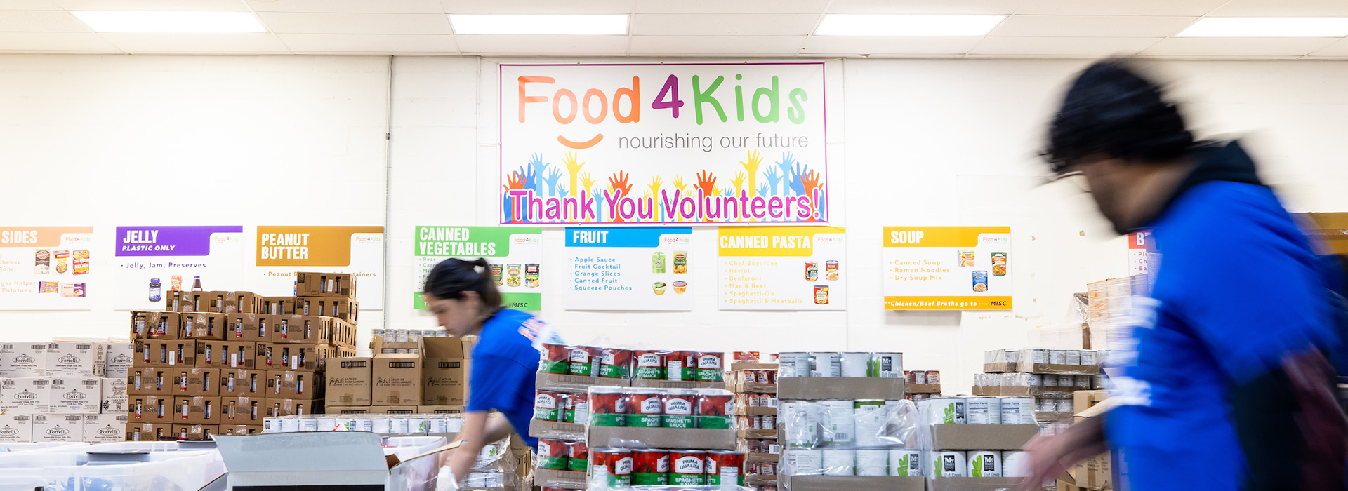 Students stocking materials for the Food4Kids backpack program.